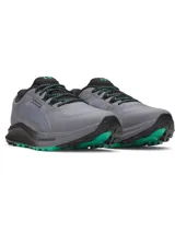 Championes de trail running Under Armour Charged Bandit TR 3, de color gris con detalles en negro y verde. Confeccionados con parte superior de malla ligera, refuerzos estratégicos y tecnología Charged Cushioning en la entresuela para mayor amortiguación y respuesta.