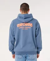 Canguro con capucha Rip Curl modelo Surf Puff Hood, color azul, con estampa en la espalda con el texto 'Ripcurl Surfing Company Since 1969' en color naranja.