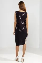 Musculosa negra con estampado de sirenas blancas, corte recto y lazos laterales ajustables.