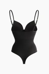 Body colaless negro con efecto push-up, tirantes ajustables y copas acolchadas. Cuenta con diseño sin costuras y efecto moldeador en la cintura.
