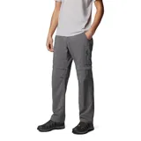 Pantalón de senderismo convertible en short, color gris, con múltiples bolsillos cargo y de seguridad. Fabricado con tecnología Omni-Shade para protección solar y Omni-Wick para gestión de la humedad, cuenta con cintura parcialmente elástica y cinturón integrado.