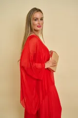 Blusa verde manzana de corte holgado y asimétrico, con mangas murciélago midi y escote redondo.