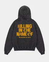 Hoodie canguro con cierre frontal, color negro con efecto acid wash, con capucha y bolsillos tipo canguro. Presenta el texto estampado en amarillo "Now You Do What They Told Ya" en el pecho.