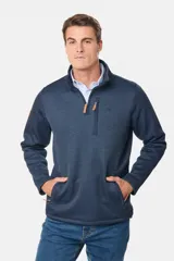 Buzo de felpa con interior de polar, diseño de medio cierre frontal, cuello alto y bolsillos laterales y en el pecho con cierres.