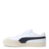Championes urbanos Puma modelo 9T, color negro con detalles en blanco. Presentan una combinación de cuero sintético y gamuza en la puntera, con la icónica franja lateral de la marca y suela de goma color caramelo.