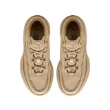 Championes Puma modelo Karmen X-tra, color beige, con diseño de plataforma alta y suela dentada. Presentan una silueta robusta con detalles de costuras y el logo de la marca en el lateral y el talón.