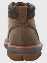 Bota de cuero marrón con ajuste de cordones, cuello acolchado de tejido técnico y suela tecnológica Spinal Flex de alta amortiguación.