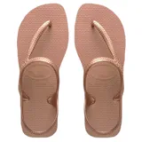 Sandalias tipo ojota Havaianas modelo Flash Urban, con diseño de tiras que envuelven el talón y el empeine. Presentan una textura granulada característica de la marca y un acabado metalizado en color cobre.
