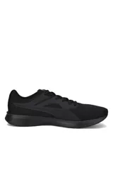 Championes deportivos Puma Transport de color negro, con diseño de malla transpirable, cordones tono sobre tono y la clásica franja lateral característica de la marca.