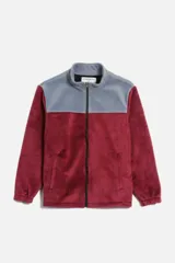 Campera de polar con cierre frontal completo, cuello alto y diseño bicolor en gris y negro. Cuenta con bolsillos laterales y puños elásticos.