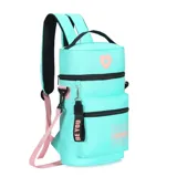 Mochila matera color beige con detalles en lila y negro. Cuenta con un bolsillo frontal extra, correa y llavero desmontable, y tiras con tela mesh. Tiene un parche de corazón lila en la parte superior y la palabra "TRENDY" estampada en lila en el bolsillo frontal.