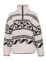 Sweater polar crudo con cuello alto y medio cierre, tejido con diseños étnicos en negro. Detalles de cuero en los bordes. Confeccionado con lana y alpaca.