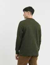 Remera de punto canalé francés con cuello polo, manga larga y cierre frontal de metal con tirador personalizado.