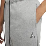 Pantalón de jogging Jordan Essentials Fleece, color gris melange, con cintura elástica ajustable mediante cordón negro, bolsillos laterales y logo Jumpman bordado en la pierna izquierda.