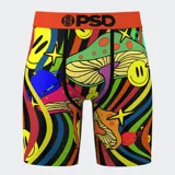 Calzoncillos bóxer estampados con hongos, planetas, estrellas y caritas sonrientes sobre un fondo de rayas de colores. Cintura elástica naranja con logo PSD.
