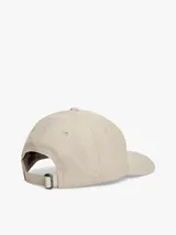 Gorra de béisbol Tommy Hilfiger color beige con diseño de seis paneles y patrón integral de monogramas en jacquard.