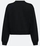 Buzo negro de algodón, de corte holgado, cuello redondo y mangas largas.