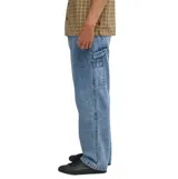 Pantalón de jean Billabong modelo Bad Dog, color azul claro, de corte recto y estilo carpintero.