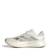 Championes de running Adidas modelo Duramo SL 2, color blanco con detalles en beige y suela de goma color caramelo. Presentan el diseño clásico de las tres tiras en los laterales y tecnología de amortiguación en la entresuela.