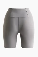 Mallas cortas de correr de talle alto y ajuste ceñido, color gris, con cintura ancha y bolsillo oculto en la parte trasera.
