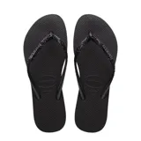 Sandalias tipo ojota Havaianas modelo Slim Glitter II, color beige arena. Presentan tiras finas con acabado de glitter brillante y logo de la marca en relieve.