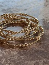 Pulsera elástica de cuentas de 2 y 4 mm en oro laminado 14 Kilates (Goldfilled).