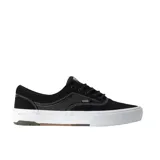 Championes de skate Vans modelo Era Wafflecup, color negro con suela blanca. Presentan capellada de gamuza, cuello acolchado, refuerzo DuraCap en zonas de desgaste y plantilla PopCush para mayor amortiguación.