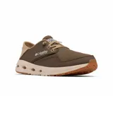 Championes Columbia modelo Bahama X Relaxed, color marrón con detalles en beige. Presentan un diseño híbrido de cuero y lona, con talón plegable, cordones elásticos y suela con orificios de drenaje para actividades acuáticas.