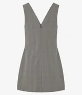 Vestido corto sin mangas confeccionado en crepé con estampado de cuadros. Presenta escote en V tanto en la parte delantera como en la trasera, breteles anchos y lapelas delanteras con botones estilizados.