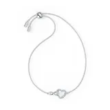 Pulsera Swarovski bañada en rodio, con cadena fina plateada ajustable. Presenta un dije con el símbolo del infinito entrelazado a un corazón, ambos adornados con pequeños cristales blancos.