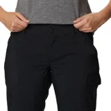 Pantalon convertible para mujer de Columbia, color negro, con perneras desmontables mediante cremallera que permiten convertirlo en short. Cuenta con bolsillos laterales y traseros, y tecnología de protección solar.
