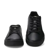 Championes Puma Court Classico de color negro, con diseño urbano de inspiración deportiva, capellada sintética, cordones negros y detalles de la marca en dorado.