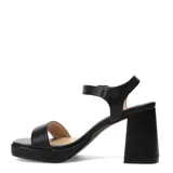 Sandalias de tacón alto y ancho con plataforma delantera, color negro, con tira frontal ancha y pulsera ajustable al tobillo con hebilla metálica.