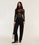 Pantalón baggy de sarga con estampado de leopardo, tiro alto, bolsillos delanteros y traseros, cierre con botón y cremallera.