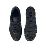 Championes de running Adidas Megaride, color negro con detalles en azul y plateado. Presentan un diseño técnico con malla transpirable y una suela distintiva con estructura de túneles para amortiguación.