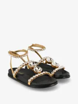 Sandalias negras con tiras adornadas con apliques brillantes y cierre con hebilla en el tobillo.