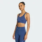 Top deportivo de soporte alto con tecnología Climacool para absorción de sudor. Presenta un diseño de espalda racer-back, tirantes fijos y almohadillas integradas, confeccionado en tejido elástico ajustado al cuerpo.