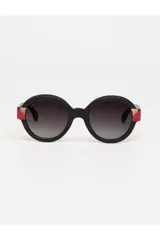 Lentes de sol Tiwi modelo Kora, con armazón redondo de acabado mate en color negro. Presentan detalles decorativos en los laterales en tonos rosa y rojo con acentos metálicos.