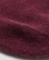 Gorro tipo beanie de punto confeccionado en 100% cachemira, con diseño clásico y borde doblado.