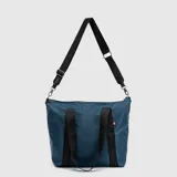 Bolso tipo tote de la marca Bubba, color azul petróleo, con cierre superior, doble asa de mano y correa larga ajustable y extraíble. Presenta detalles de cintas negras con el logo de la marca y una pequeña etiqueta lateral.