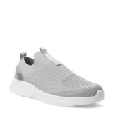 Championes deportivos Umbro modelo Glide, color gris con diseño de tejido tipo knit y suela blanca de goma. Presentan un estilo slip-on con tiradores en el talón y lengüeta, y un detalle gráfico en el lateral del talón.