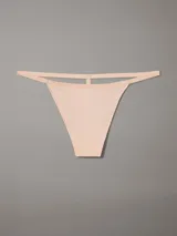 Colaless de estilo string color piel, con cintura elástica con logo de Calvin Klein tonal.