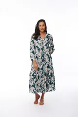 Vestido midi de poliéster color verde oscuro con estampado floral en tonos beige y blanco, escote en V y mangas largas.