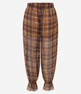 Pantalón aladim Blue Steel de chiffon con estampado de cuadros, corte amplio y voluminoso en las piernas. Cuenta con cintura elástica y acabado con fruncido en los tobillos.