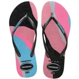 Sandalias de dedo Havaianas Slim Palette Glow para mujer, con tiras finas negras con brillos y logo en relieve. Suela con estampado ondulado multicolor en tonos negros, rosados, celestes y grises, con acabado brillante.
