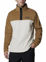 Buzo polar Columbia modelo Steens Mountain, de diseño color block en tonos beige y blanco. Presenta cuello alto con cierre de botones a presión, mangas largas y logo de la marca bordado en el pecho.