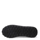 Championes urbanos Caterpillar modelo Hex +, color negro con detalles en amarillo. Confeccionados en cuero napa texturizado, cuentan con suela de goma robusta y cierre mediante cordones.