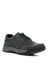 Zapatos de cuero Hush Puppies modelo Duran Navy, de color gris oscuro, con cordones y suela de goma.