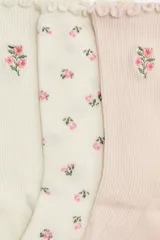 Pack de cinco pares de medias de punto acanalado en colores pastel y neutros, con detalle de ribete sobrehilado en el borde superior y bordados de flores pequeñas.
