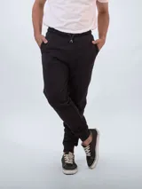 Pantalón de jogging negro con cintura elástica ajustable con cordón y puños ajustados.